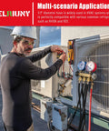 HVAC vacuum hose connected to refrigerant manifold gauges on outdoor condenser; technician wearing hard hat