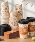 Straight Fire 50 Pack Party Bundle Includes 16 Oz Plastic Coffee Cups With Secure Black Lids And Extra Warm Insulated Sleeves crafted for baby brewing celebration, displayed with cups and lids.