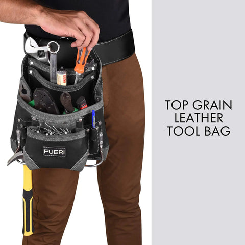 Man wearing black full grain leather tool pouch with 10 pockets and dual hammer holster, showcasing tool organization.