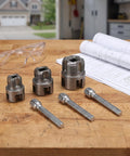 Heavy Duty Dual Function Pipe Threader Kit For Power Drill Cuts And Threads Half Through One Inch PVC Pipe With No Sweat Dead Easy Install Smooth Operation on workbench with several metal threading insert sizes.