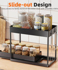 Smooth Pullout Under Sink Organizer Two Pack Heavy Duty Metal Rack For Kitchen And Bathroom Big Stack Zero Clutter Solid Setup Storage Game Changer In Black with jars and utensils.