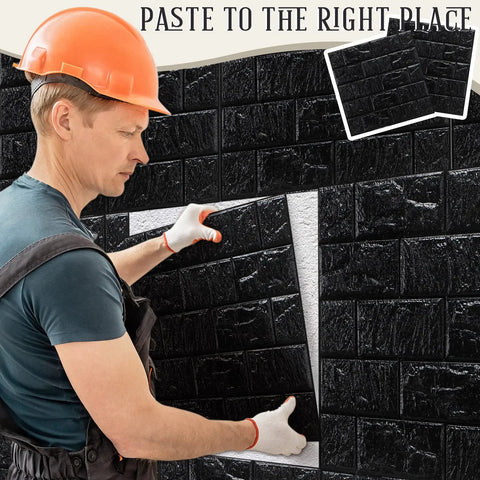 Installer applying Sleek Black 3D Wall Panels Peel And Stick Foam Brick Wallpaper Tiles on wall with adhesive, DIY decor.