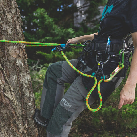 Climber using Sidekick Lanyard Manager Auto Adjusts To Most Lanyard Diameters With One-Handed Operation And Multiple Attachment Orientations Lightweight Durable Construction For Easy Setup And Tangled-Free Canopy Use 99563