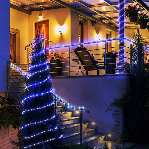 Solar Rope Lights Outdoor Waterproof, 39.37 Feet Copper Wire With Clear PVC Tubing illuminating patio and tree railing at night