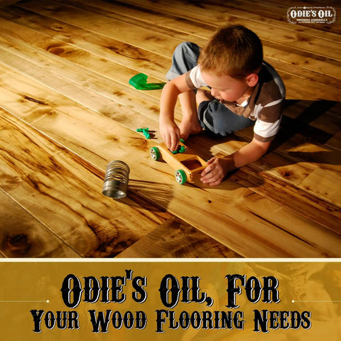 Child playing on wooden floor treated with Universal Finish For Wood Leather Plastic Vinyl Metal And More Workhorse All Purpose 9 Oz Jar