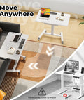 Flex Your Workspace Routine With This Slick Rollaway Standing Desk Featuring A Roomy Desktop Pull Out Storage Bin Built In Mug Holder Heavy Duty Side Hooks And Easy Glide Wheels, showcasing a mobile desk by a sofa.