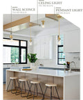 Modern kitchen with Gold Pendant Light 2 Pack With Clear Glass Shade, adjustable height, over kitchen island with stools.