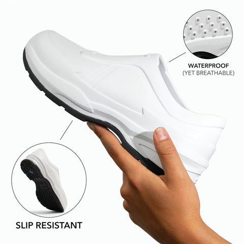 All Day Slip Resistant Comfort Work Shoe For Nurses And Chefs With Wide Toe Box held in hand showing sole and ventilation