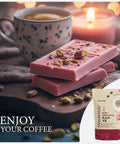 Ruby Chocolate Instant Turkish Coffee Blend With Fruity Creaminess For Bold Mornings, Hot Or Iced, Works In Cezve Or Any Coffee Machine, 165g Great For Espresso Lovers shown with pink chocolate, coffee cup, and candle setting.