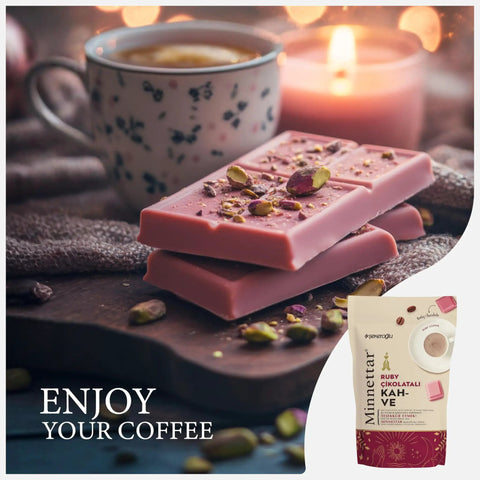 Ruby Chocolate Instant Turkish Coffee Blend With Fruity Creaminess For Bold Mornings, Hot Or Iced, Works In Cezve Or Any Coffee Machine, 165g Great For Espresso Lovers shown with pink chocolate, coffee cup, and candle setting.
