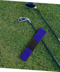 Two Piece Golf Swing Training Arm Strap Set on grass with golf clubs, a durable arm corrector for better swing form.