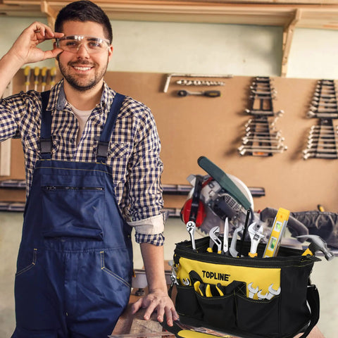 Man in workshop with 467 Piece Household Tool Set For Home And Garage Ready Projects In A 16 Inch Tool Bag