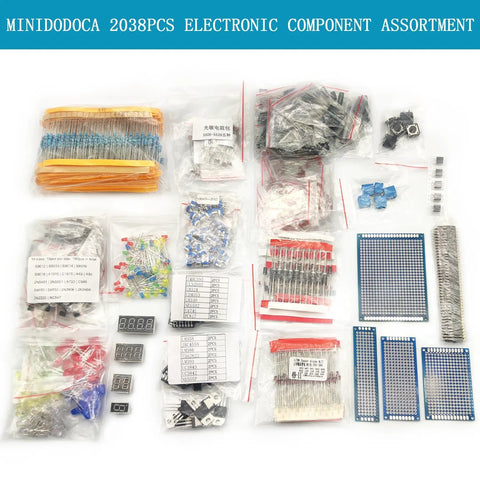 All In One Electronic Component Kit With 2038 Pieces Including LEDs Diodes Resistors Capacitors ICs Transistors PCBs Digital Tubes And Voltage Regulators For DIYers And Pro Techs A Handy Starter Set, various components displayed on a table.