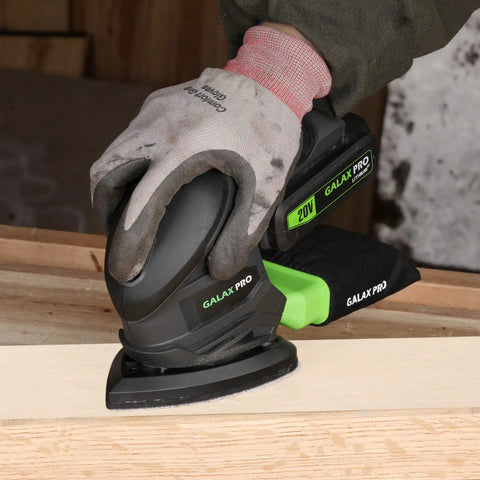 Cordless Detail Sander Kit With 20V Battery And Charger Included sanding wooden panel, showing dust bag and ergonomic design.