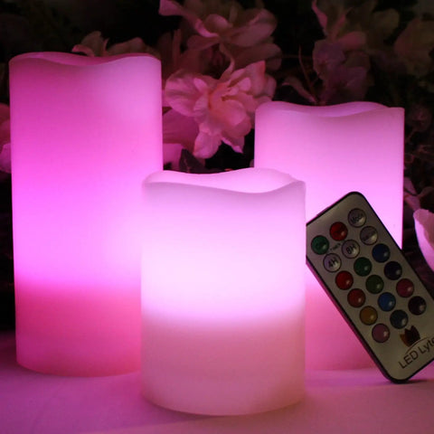 Multi Colored Flameless Candles Set Battery Operated With Remote Control Flickering Flame Ivory Wax Pillars glowing with pink light
