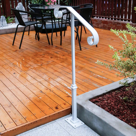 Outdoor white hand rail near wooden deck, metal base, garden view