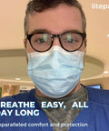 Person wearing blue disposable mask from Bulk Disposable Face Masks 1000 Pack For Home And Office Breathable And Comfortable Non Medical Use.