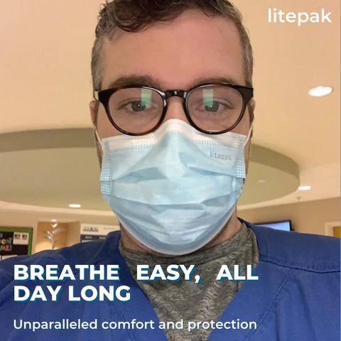 Person wearing blue disposable mask from Bulk Disposable Face Masks 1000 Pack For Home And Office Breathable And Comfortable Non Medical Use.