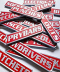 Heavy Duty Magnetic Toolbox Labels Set, 12 Pack Red, 3D Breaker Style showing assorted tool labels in a workshop setting.