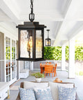 Outdoor Pendant Light Fixture for Porch and Front Door, Farmhouse Exterior Hanging Lantern with Adjustable Chain, shown on porch