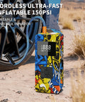 Beast 8000A Jump Starter With Air Compressor And Tire Inflator in use near a car wheel on a sandy terrain.