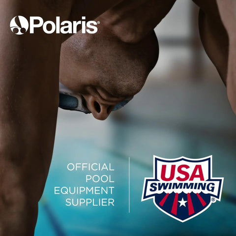 Focused swimmer with goggles preparing to dive, Polaris and USA Swimming logos displayed, promoting official equipment partnership.