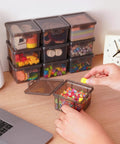 Person organizing beads into 10 Pack Small Plastic Storage Containers With Lids Black Square Mini Boxes For Beads Crafts Jewelry Findings Stickers Tiny Tools And Small Items Stackable Organizer Bins on a desk.