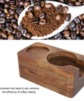 Rock Steady 58 Mm Coffee Tamper Stand With Solid Hardwood Portafilter Holder For Smooth Espresso Pulls And Slip Proof Tamping Platform, featuring a wooden design with grooves.
