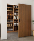 Image of a 42 By 84 Inch Concealed Sliding Barn Door With Soft Close Mechanism and Heavy Duty Track System, showcasing brown finish in a pantry setting.