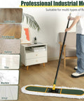 Heavy Hitting Commercial Cotton Dust Mop With Massive 39 Inch Sweeping Pad And Rock Solid Handle in use on hardwood floor.