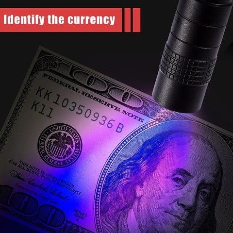 4 Pack UV Black Light Pen Lights For Urine Leaks And Stain Detection shining on currency for authenticity check