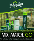 Display of Murphy's Naturals mosquito repellent products including sprays, incense, and candles outdoors.