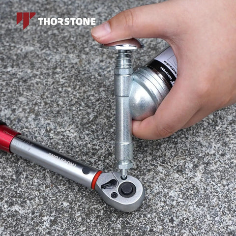 Mini Grease Gun For Tight Spots One Handed Push Type With Needle Nozzle 3oz Capacity in use on a ratchet tool