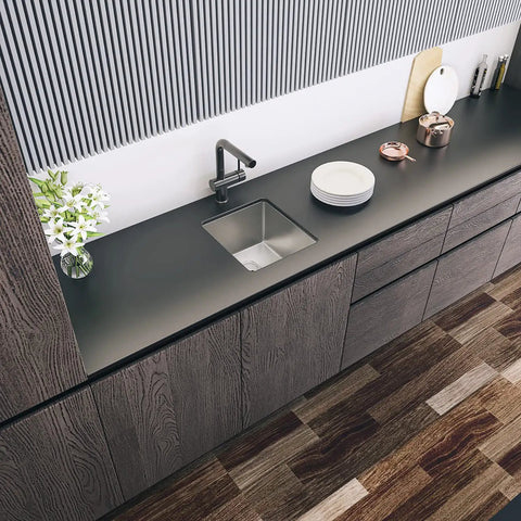 Overhead view of undermount 23x18x9 single bowl kitchen sink in 18 gauge 304 stainless steel with black finish, installed in a modern kitchen counter.