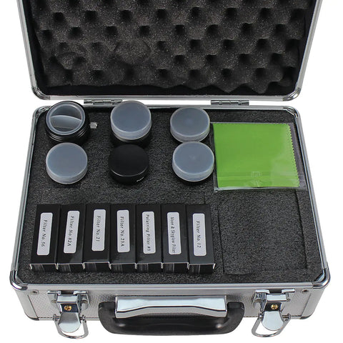 Open metal case displaying the 1.25 Inch Telescope Accessory Kit with Five Plossl Eyepieces, 2X Barlow Lens, and Seven Filters.