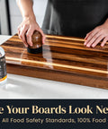 Person conditioning wood cutting board with Food Grade Mineral Oil For Wood Cutting Boards And Butcher Blocks 16oz Safe For Bamboo