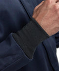 Close-up of Arc Flash Short Coat 12 Cal UltraSoft Navy FR Workwear cuff with black ribbed knit detail.