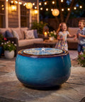 9 Inch Outdoor Ceramic Water Fountain With LED Light Round Bubbler Water Feature Eastern Style Waterfall Blue Garden Decor For Yard Patio Balcony Deck Porch on stone surface at night with children playing in background