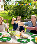 Dope 90 Piece Golf Party Paper Plates And Disposable Napkin Set Featuring Fresh Green Golf Course Layouts With Cool Sports Ball Print Tableware at outdoor celebration.