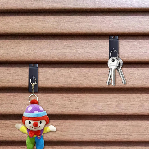 Metal Slatwall Utility Hooks 10 Pack Set Heavy Duty Slatwall Hangers For Photos Frames Paintings And Art Displays Black Galvanized Finish Notch Design For Secure Mount Durable And Corrosion Resistant Easy Install holding keys and a toy clown