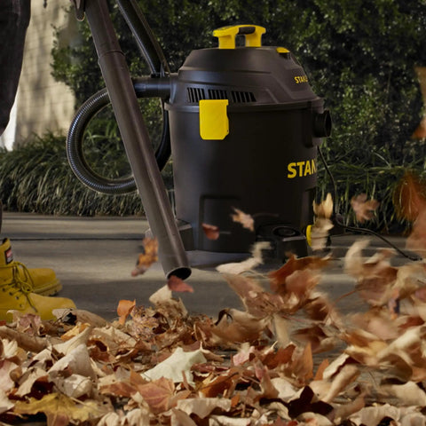 10 Gallon Wet Dry Shop Vacuum With 6 Peak HP Motor And Built In Drain in use blowing leaves on a driveway