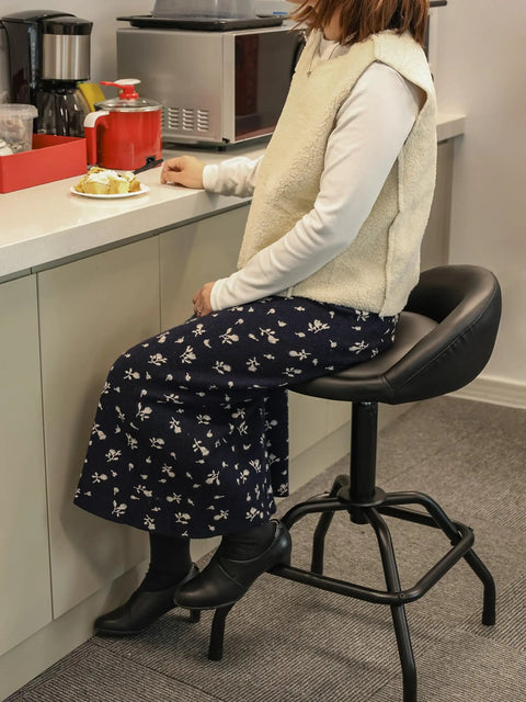 Person seated on Garage Shop Stool With Backrest Height Adjustable Pneumatic Bar Stool 25 To 31 Inches Swivel Counter Height Seating