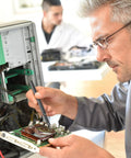 Technician using precision screwdriver set for PC repair