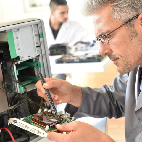 Technician using precision screwdriver set for PC repair