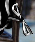 Close-up of black cabana stripe four ties on outdoor plush tufted blowfill dining chair cushion 21x40 inch rainproof, eco-friendly.