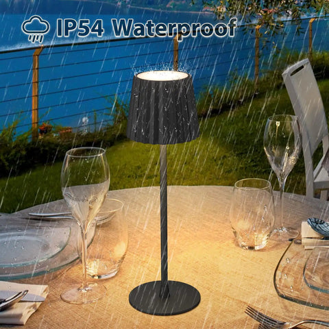 2 Pack Rechargeable Cordless Table Lamps With 3000K Dimmable Warm Light, No Fuss Touch Switch And Stepless Dimming, Battery Powered, IP54 Waterproof, Ideal For Bedroom Bedside Desk Dining Outdoor Use, Black, shown on a dining table in rain