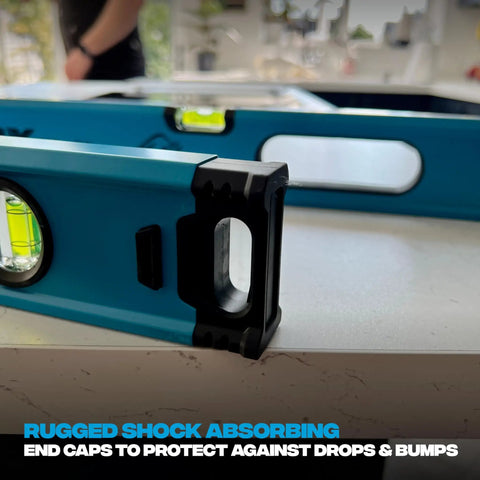 Pro Grade 2 Foot Aluminum Level Box Beam with magnified vials and shock-absorbing end caps on a surface