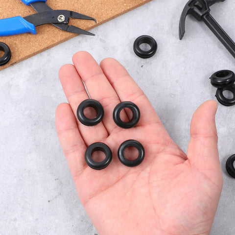 Hand holding Durable Rubber Wiring Hole Grommets 30 Pack For Wires Cables And Hoses 1/2 Inch Inner Diameter 9/16 Inch Drill Hole Protection Gaskets Anti Abrasion