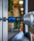 Impact Wrench Adapter Three Eighths Inch Drive Female To One Quarter Inch Hex Converter in use on a power drill for metalwork.
