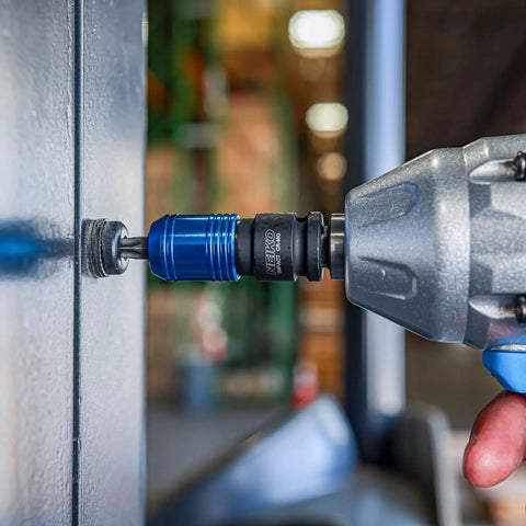 Impact Wrench Adapter Three Eighths Inch Drive Female To One Quarter Inch Hex Converter in use on a power drill for metalwork.